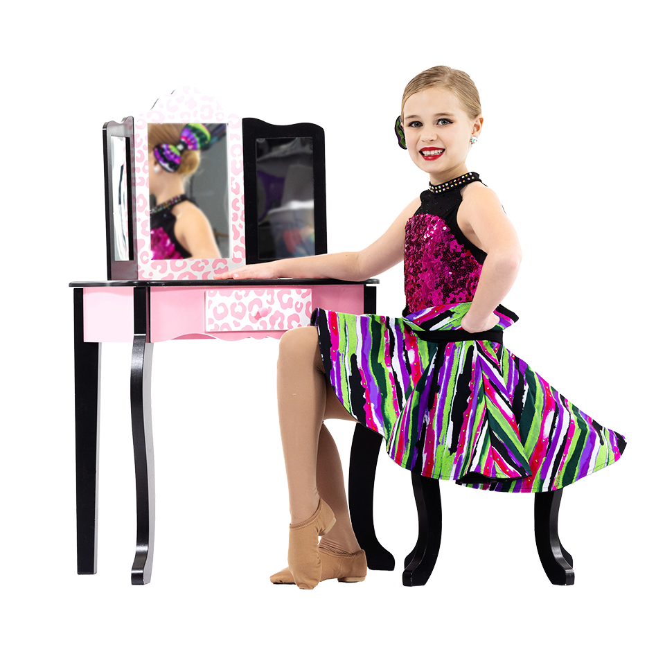 Young girl dancer sitting in front of a mirror preparing her dance attire.